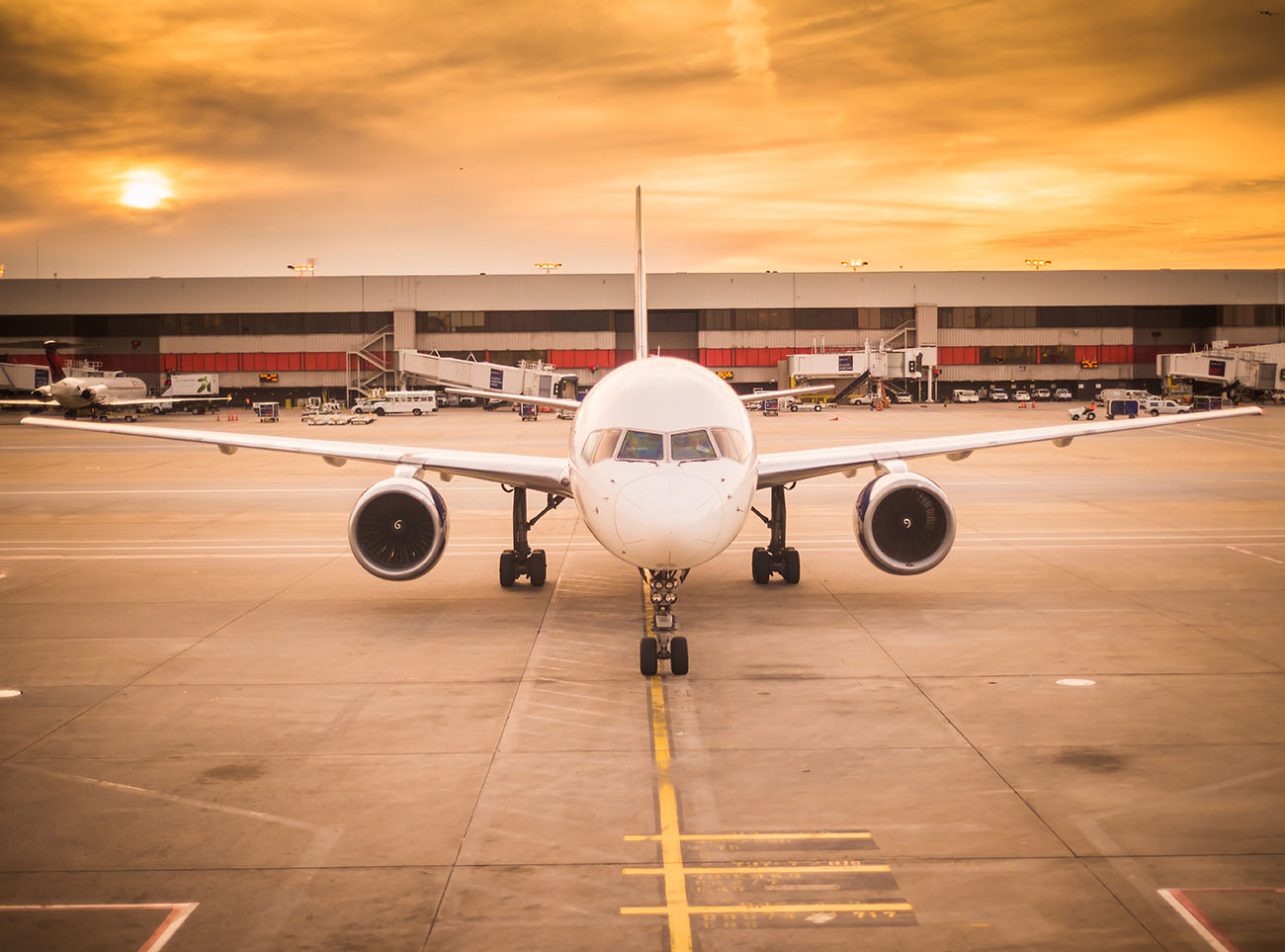 wide shot of white aeroplane at airport
