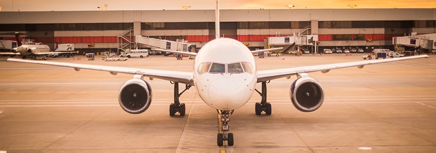 wide shot of white aeroplane at airport