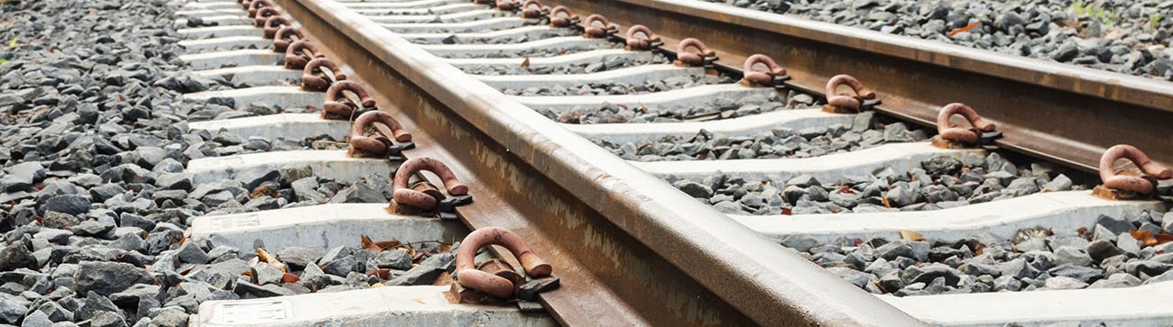 close up of train tracks and stones