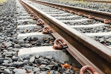 close up of train tracks and stones
