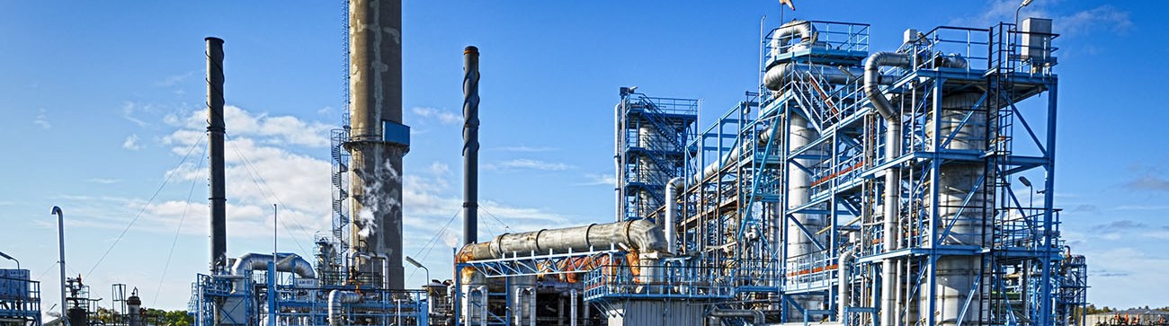 an image of industrial factories and pipes