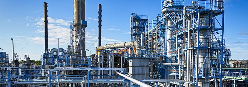 an image of industrial factories and pipes