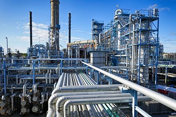 an image of industrial factories and pipes