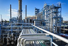 an image of industrial factories and pipes