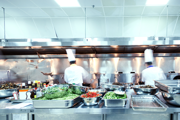 wide shot of food being prepared in a large catering kitchen