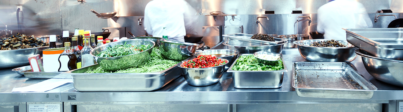 wide shot of food being prepared in a large catering kitchen