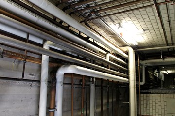 an image of silver, white and copper pipes