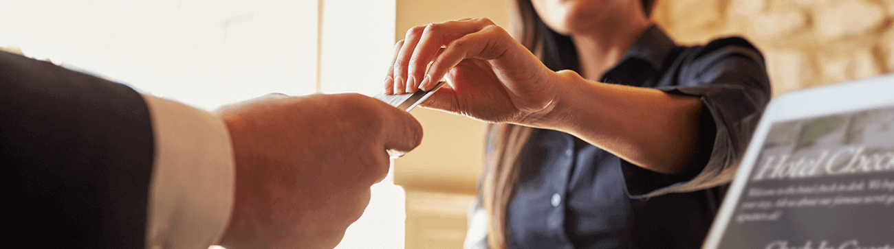 close up of two hands exhanging a bank/gift card