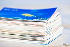 close up of a large stack of colourful paper