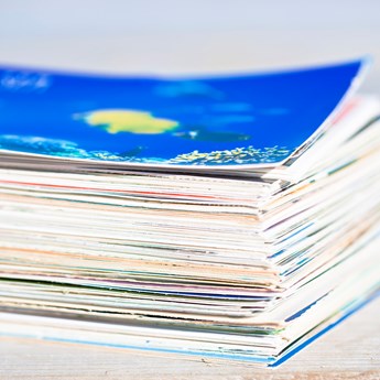 close up of a large stack of colourful paper