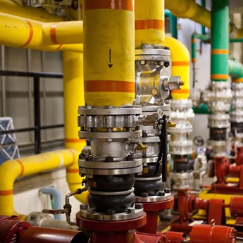 close up of industrial pipes inside a factory