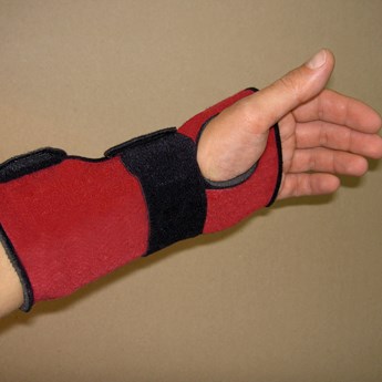 extended fore arm with red and black wrist support