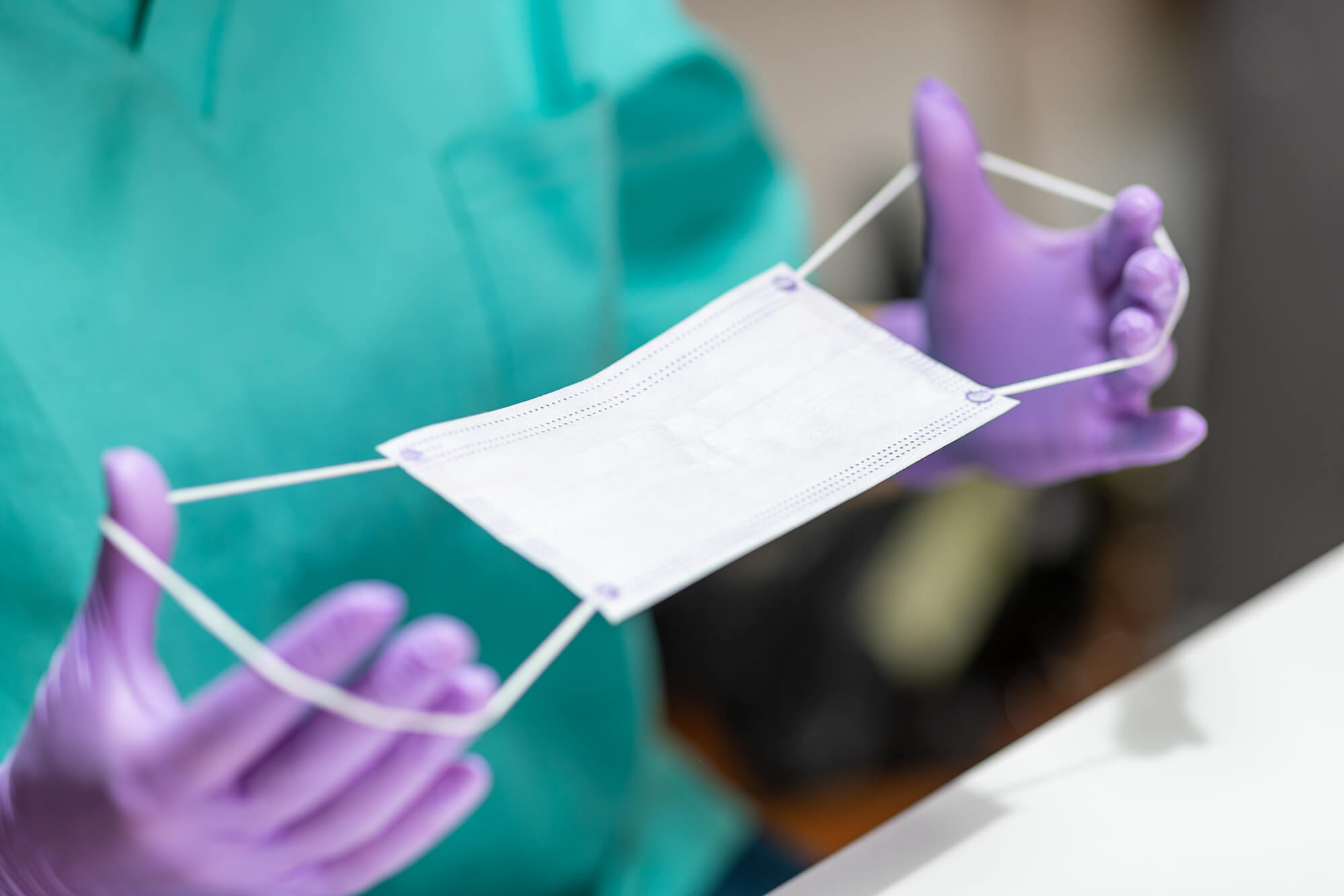 close up of white surgical disposible mask