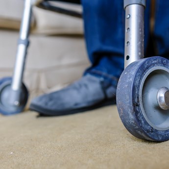 close up of walking frame wheels and shoes